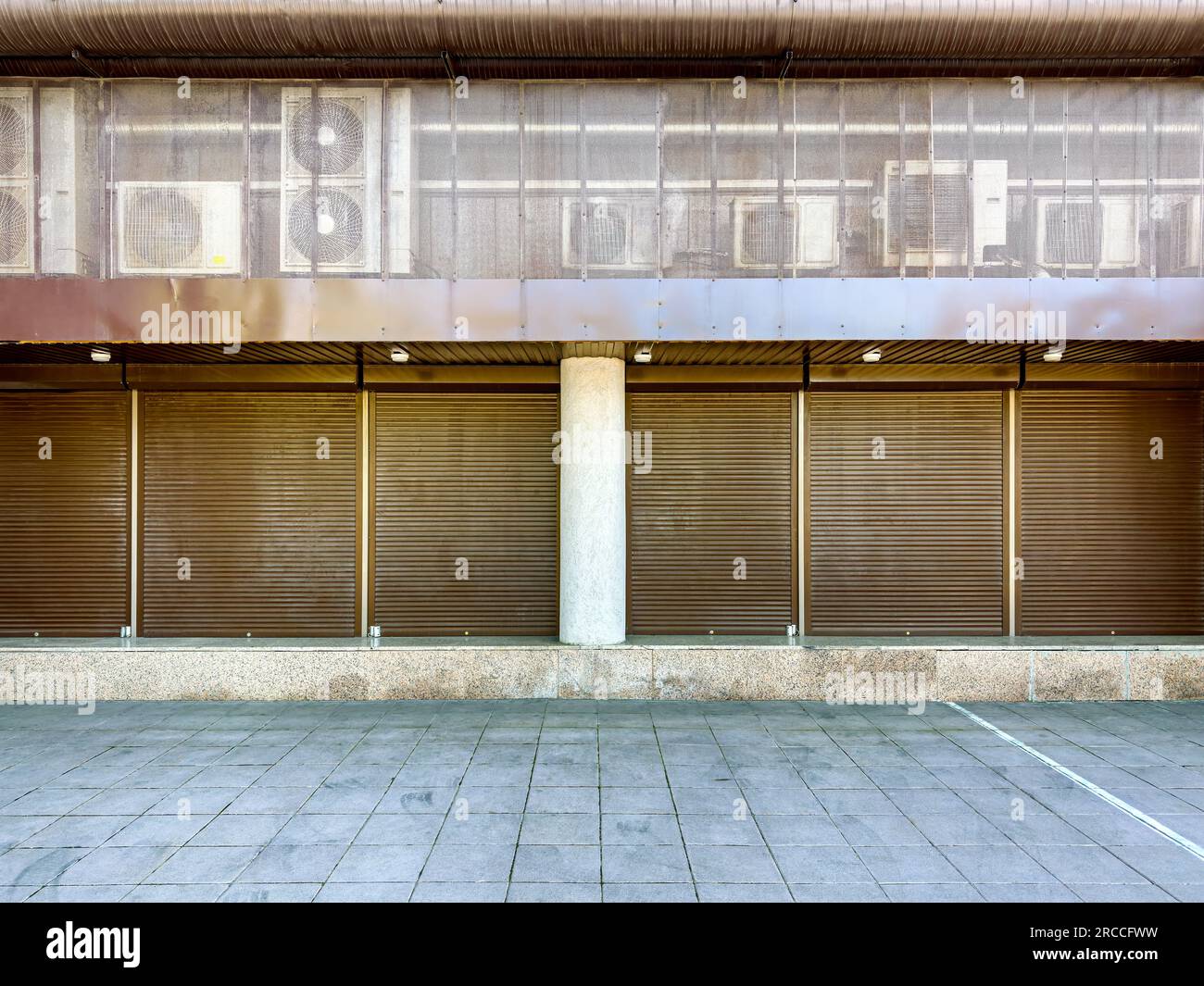 air conditioner units (HVAC) installed outside on wall of business ...