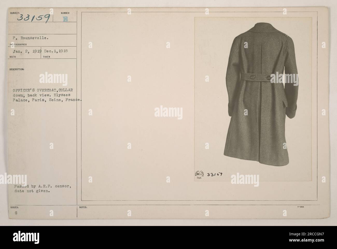 Officer's overcoat, collar down, worn by P. Rounsevelle. The photo was taken on December 1, 1918, at Elysees Palace in Paris, France. The image shows the back view of the overcoat. It was approved by the A.E.F. censor. No specific notes about the photograph were provided. Stock Photo