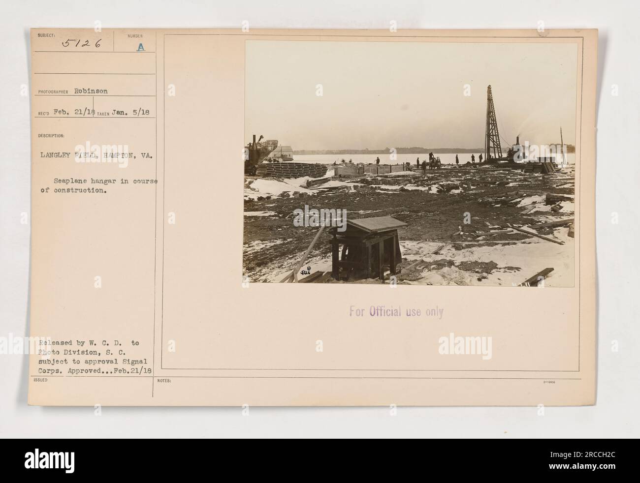 This photograph depicts the construction of a seaplane hangar at Langley Field in Hampton, Virginia. It was taken on January 5, 1918, by photographer Robinson and was released by W.C.D. to the Photo Division of the Signal Corps for approval. The image was approved for official use on February 21, 1918. Stock Photo