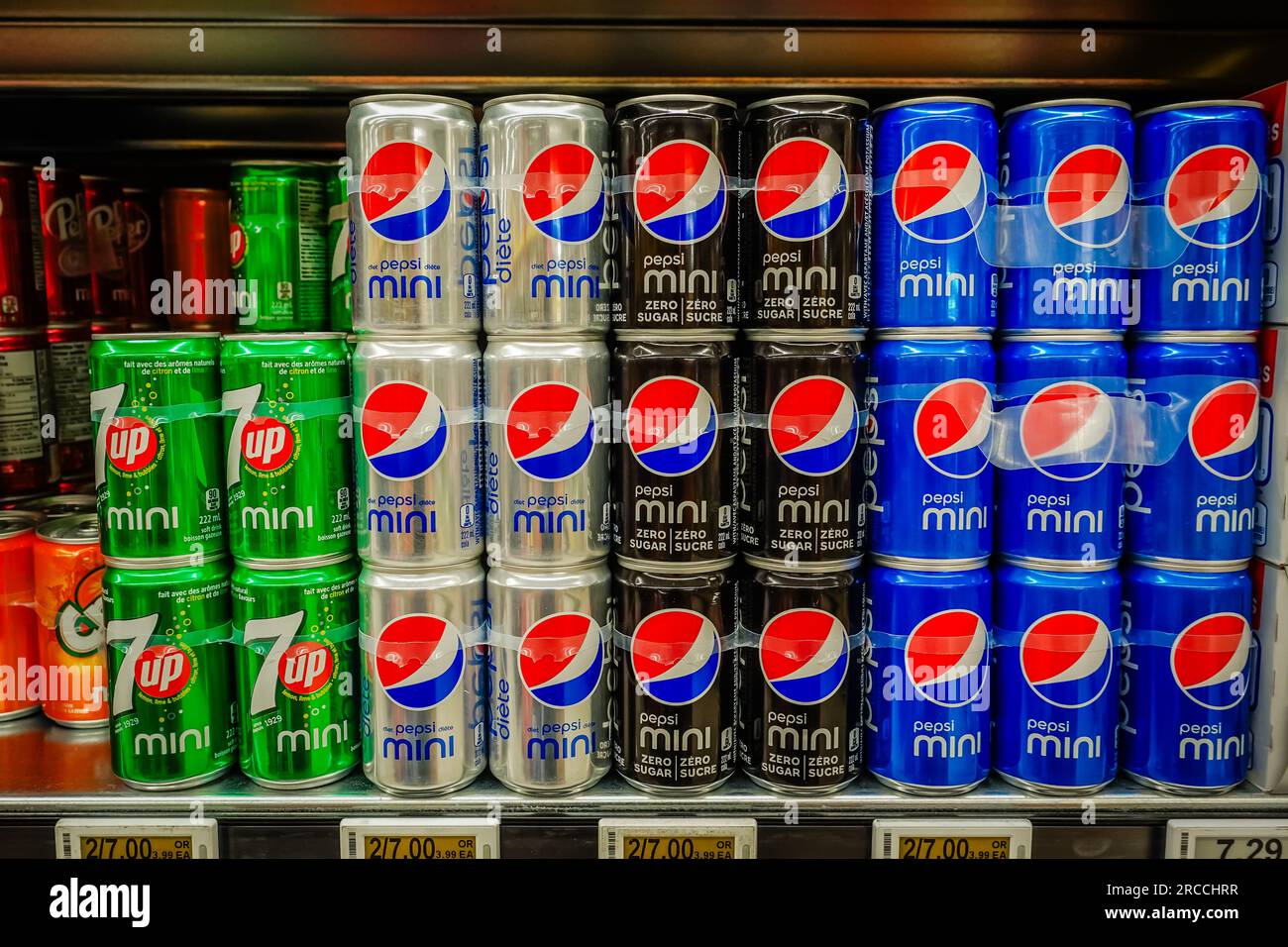 Pepsi canned soft drinks or fizzy drinks on a supermarket shelf Stock Photo