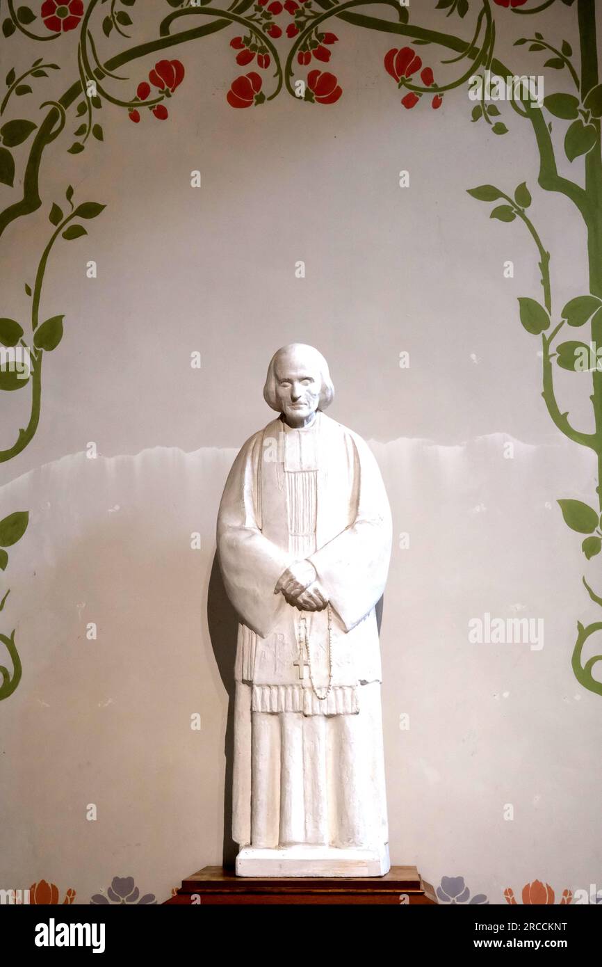 Statue of Saint Vincent de Paul in Eglise Notre Dame Du Travail in the Montparnasse district in Paris France Stock Photo