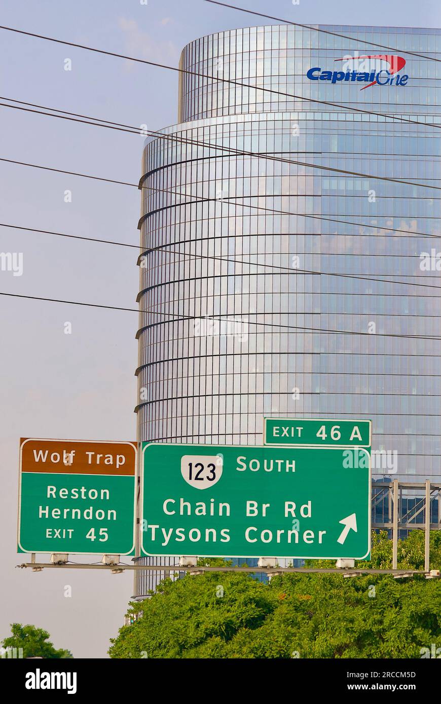 Tysons Corner, Virginia, USA - June 17, 2023: Signs on Interstate 495 show the exits for Wolf Trap and Route 123 near the Capital One building. Stock Photo