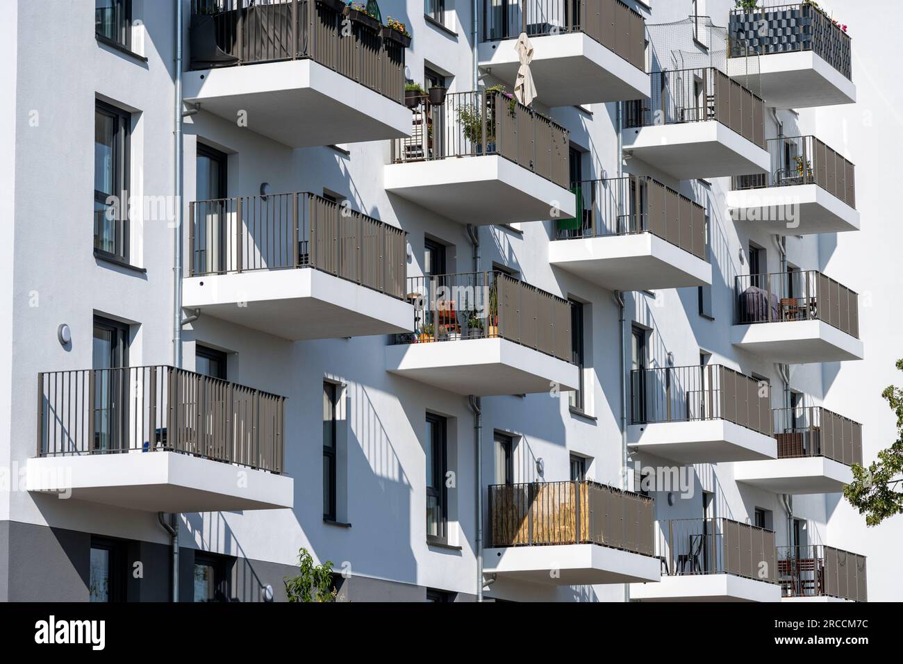 The facade of a modern white apartment building seen in Berlin, Germany ...