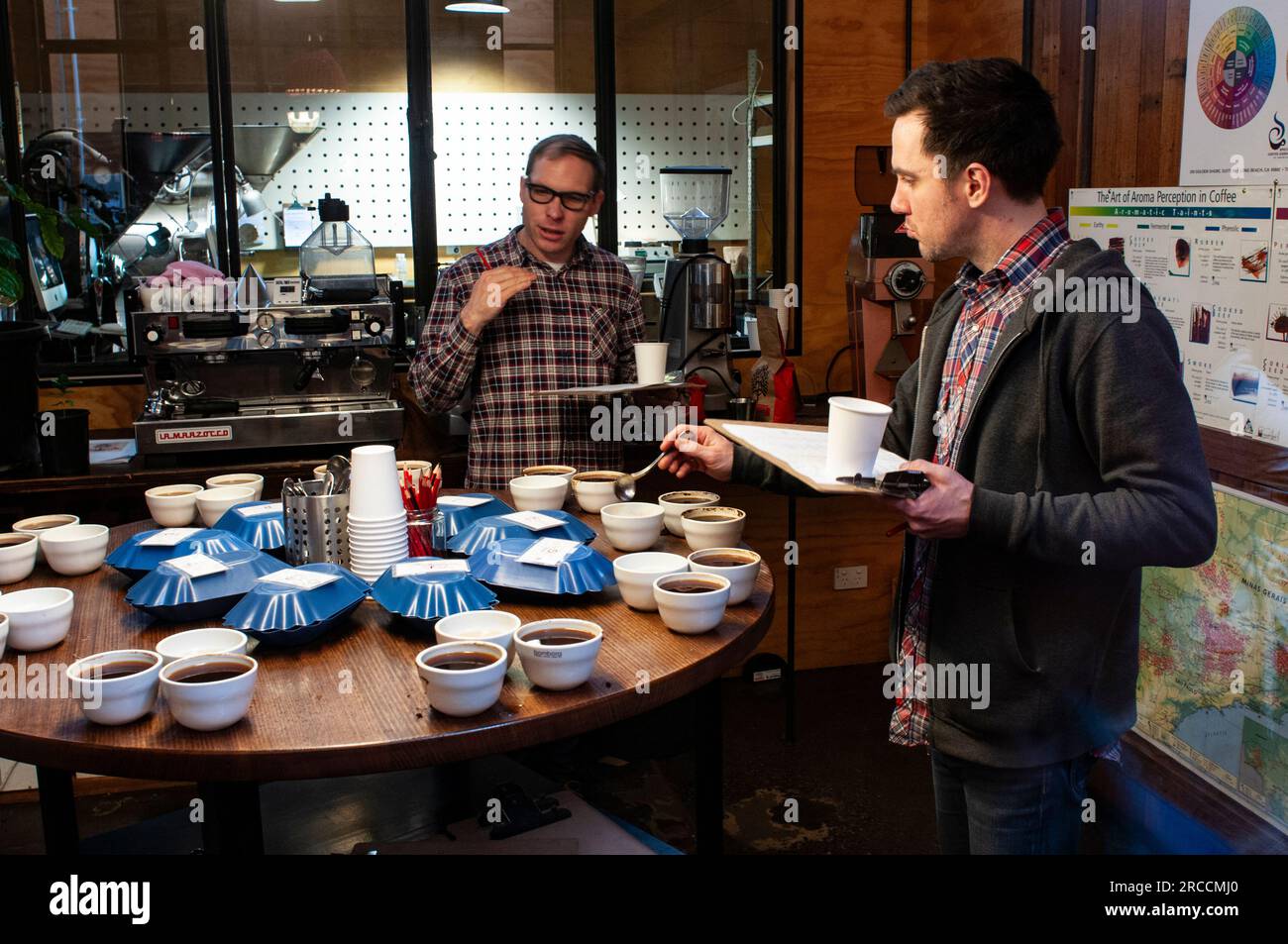 Specialist coffee tasters sampling and selecting coffee at Seven Seeds