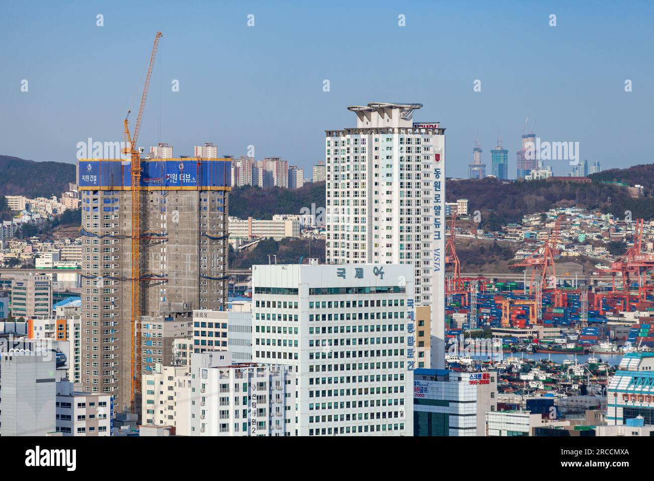Busan, South Korea - March 22, 2018: Cityscape of Busan city with skyscraper under construction, aerial view Stock Photo