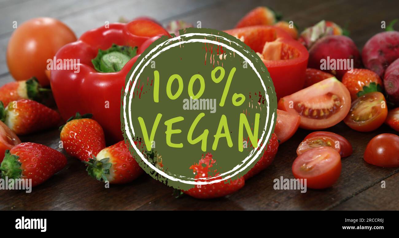 Composite of 100 percent vegan text over fruit and vegetables Stock