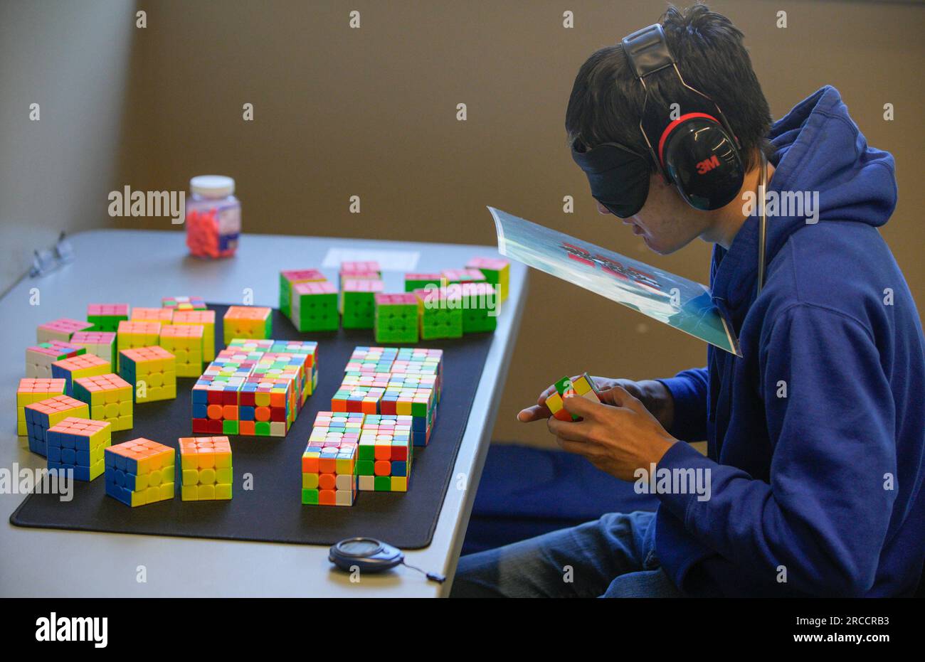 New Westminster, Canada. 13th July, 2023. A contestant solves a Rubik's Cube blindfolded during the Canadian Speedcubing Championship 2023 at the Queen's Park Arena in New Westminster, British Columbia, Canada, on July 13, 2023. A total of 320 contestants from 20 countries and regions took part in the championship from July 13 to 16. Credit: Liang Sen/Xinhua/Alamy Live News Stock Photo