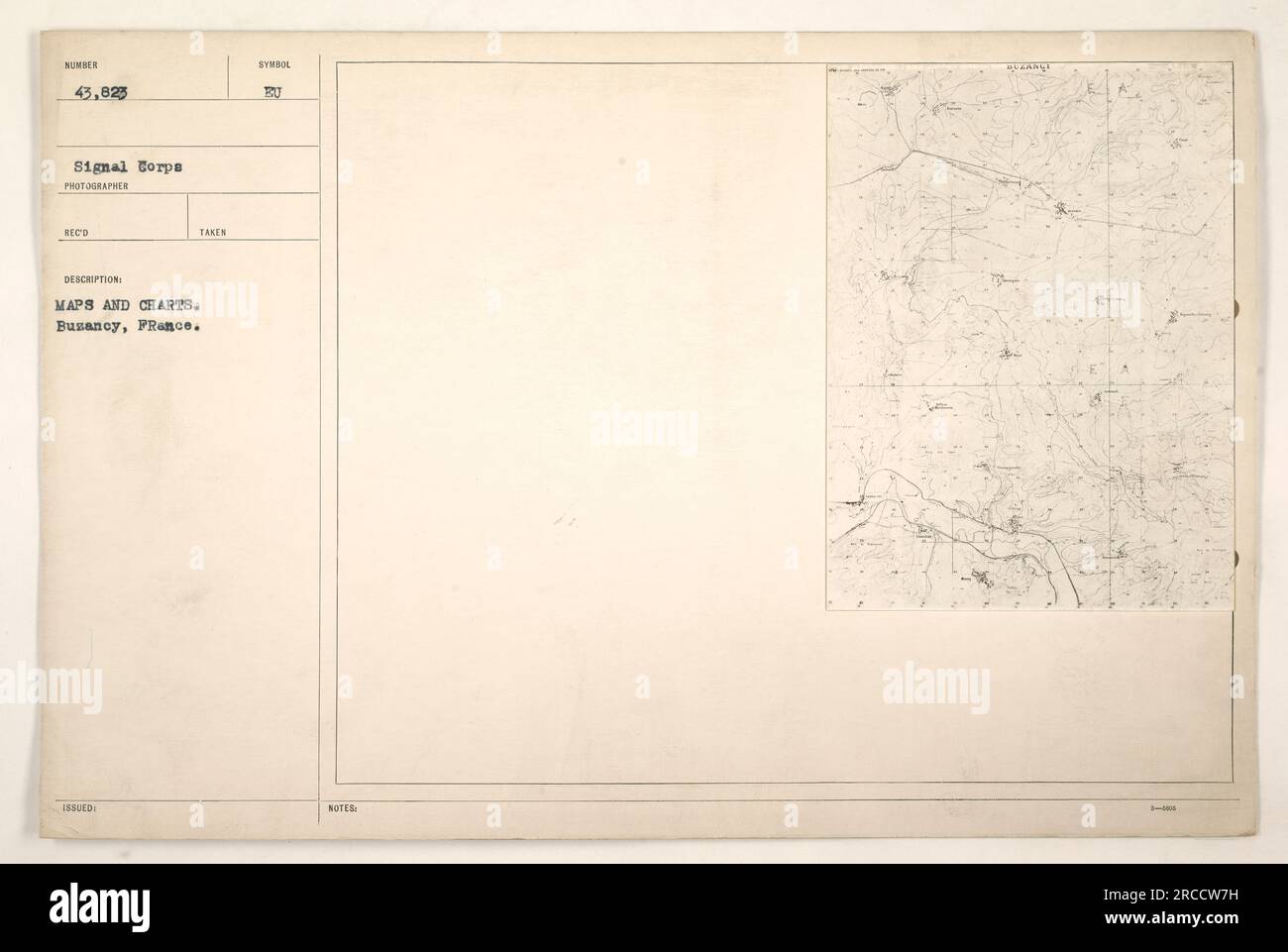American soldiers examining maps and charts in Busancy, France during ...
