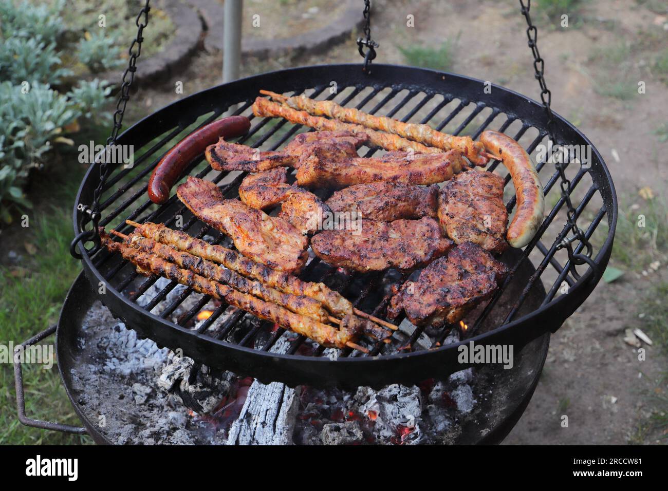 various meat and sausages on the charcoal grill Stock Photo - Alamy