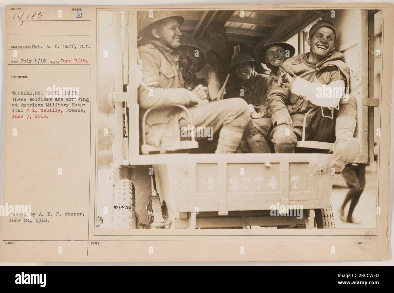 Soldiers arriving at American Military Hospital #1, Neuilly, France, June 7, 1918. Despite being wounded, these soldiers are seen smiling. Photo taken by Sgt. A. C. Duff. Approved by A. E. F. Censor on June 24, 1918. Caption information: 111-SC-14185 | Photographer: Sgt. A. C. Duff, s.c. | Date taken: July 6/18 | Description: E WOUNDED, BUT STILL HAPPY. Stock Photo