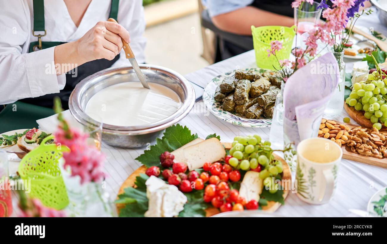 Master class and cheese tasting. Women make cheese. The enzyme and