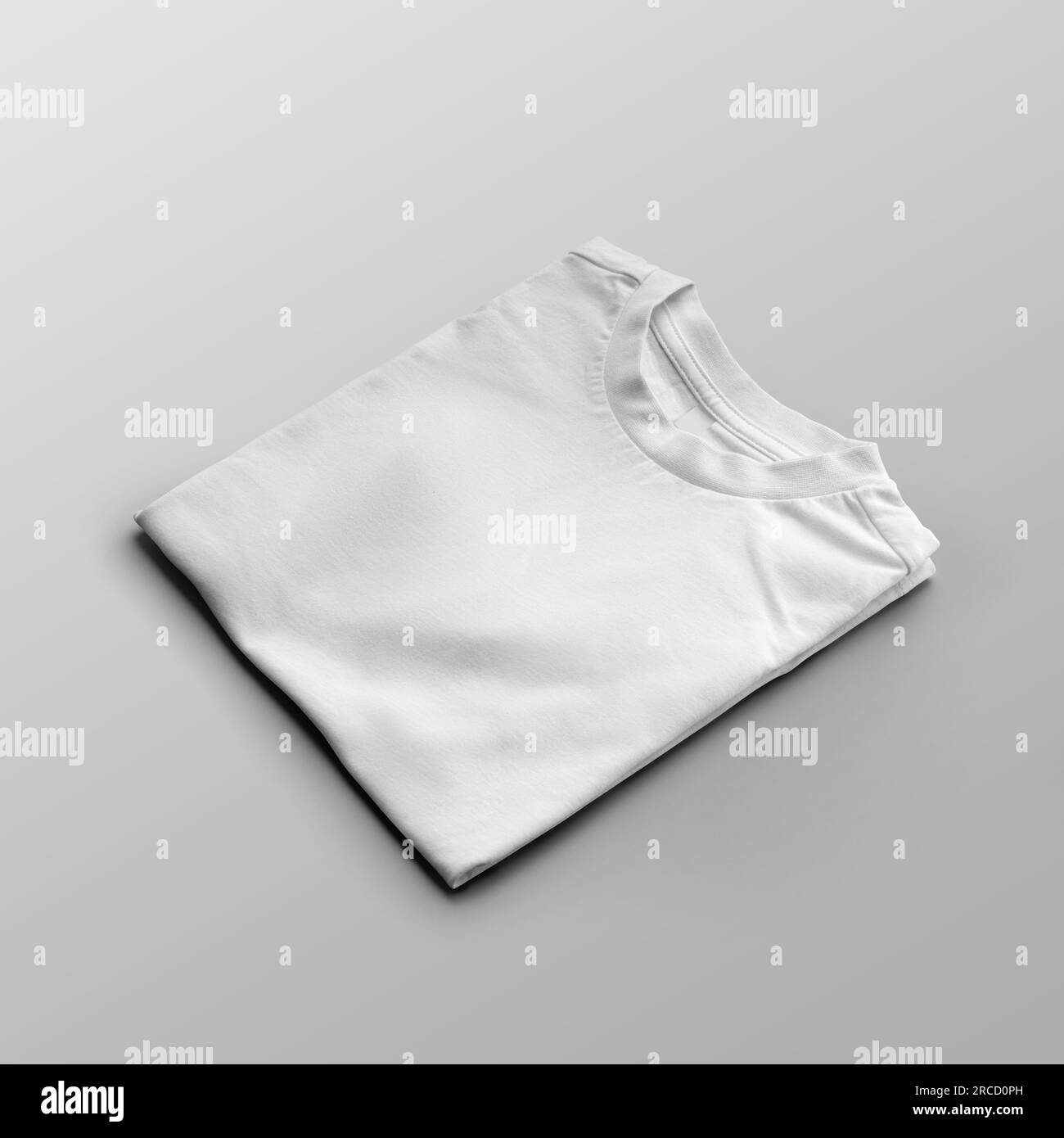 Template of a folded white t-shirt, children's clothing with a round neck, close-up, diagonal presentation, front view, isolated on background. Produc Stock Photo
