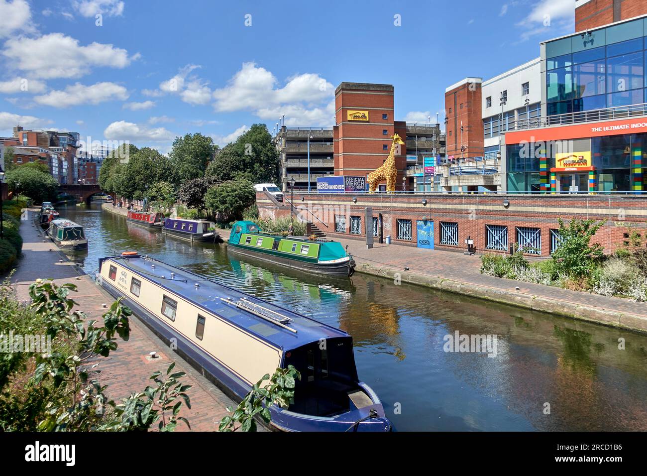 Brindley Place. Canal and narrow boats with Legoland Playground in the distance, Birmingham England UK Stock Photo