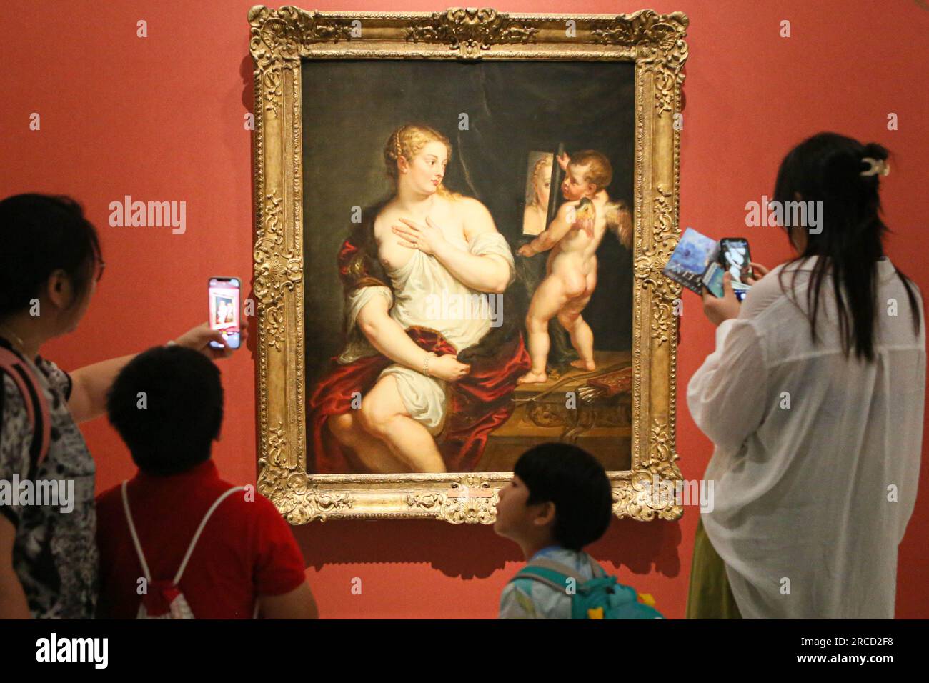 Shanghai. 22nd June, 2023. Visitors take photos of the painting 'Venus and Cupid' by Peter Paul Rubens during the exhibition 'The Greats of Six Centuries: Masterpieces from the Museo Nacional Thyssen-Bornemisza' at the Museum of Art Pudong (MAP) in east China's Shanghai July 13, 2023. The exhibition, featuring a selection of 70 paintings spanning six centuries, opened to the public at MAP on June 22, 2023 and will last till Nov. 12 this year. Credit: Xin Mengchen/Xinhua/Alamy Live News Stock Photo