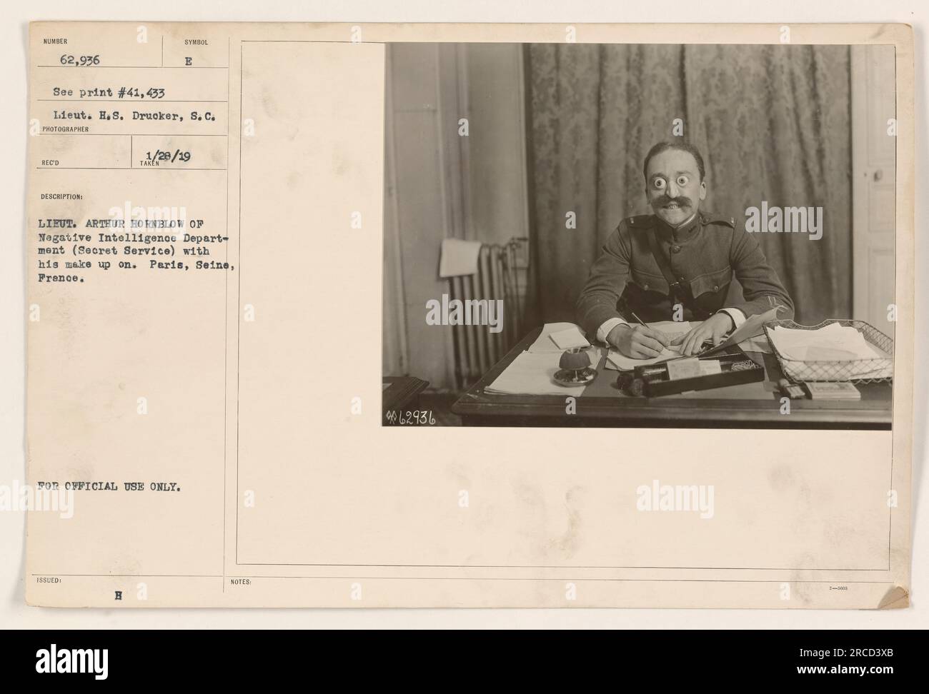 Lieutenant Arthur Hornblow of the Negative Intelligence Department (Secret Service) is pictured wearing make-up in this photograph taken in Paris, France during World War One. This image is recorded under the symbol E and print number 41,433. This photograph was taken by Lieutenant H.S. Drucker, S.C., and the description was issued on January 29, 1919. This image is labeled for official use only. Stock Photo
