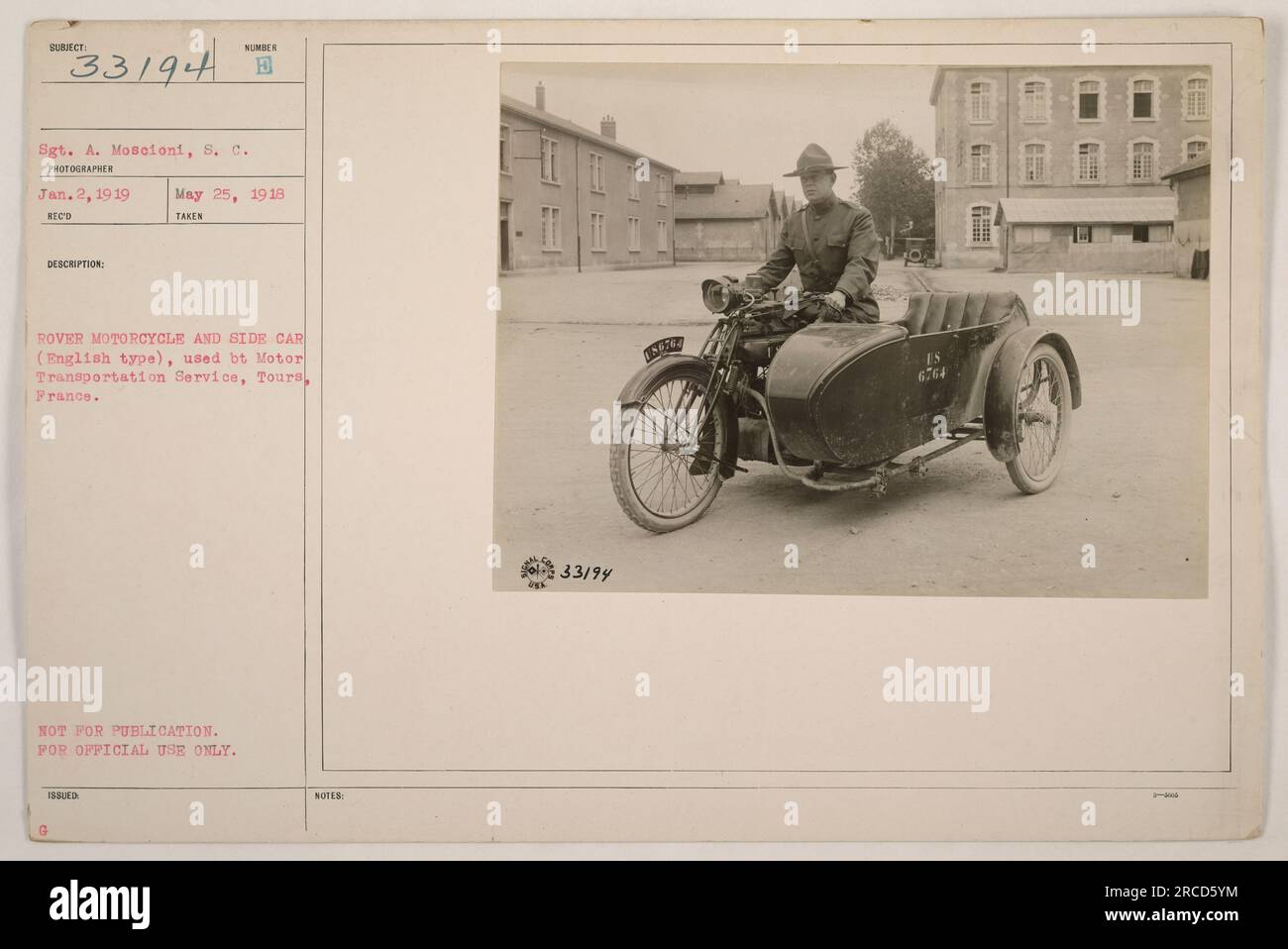 Sgt. A. Mosconi on a Rover motorcycle and sidecar (English type) used by the Motor Transportation Service in Tours, France on May 25, 1918. The photo was taken by a photographer on January 2, 1919. The image was not intended for public use but for official purposes only. Military document number 33/94 was assigned to this image. Stock Photo