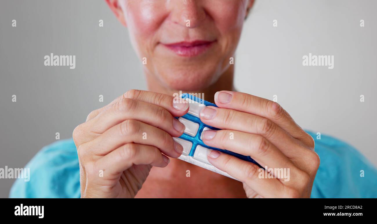 Woman Using Nicotine Gum To Quit Smoking. Nicotine Replacement Therapy