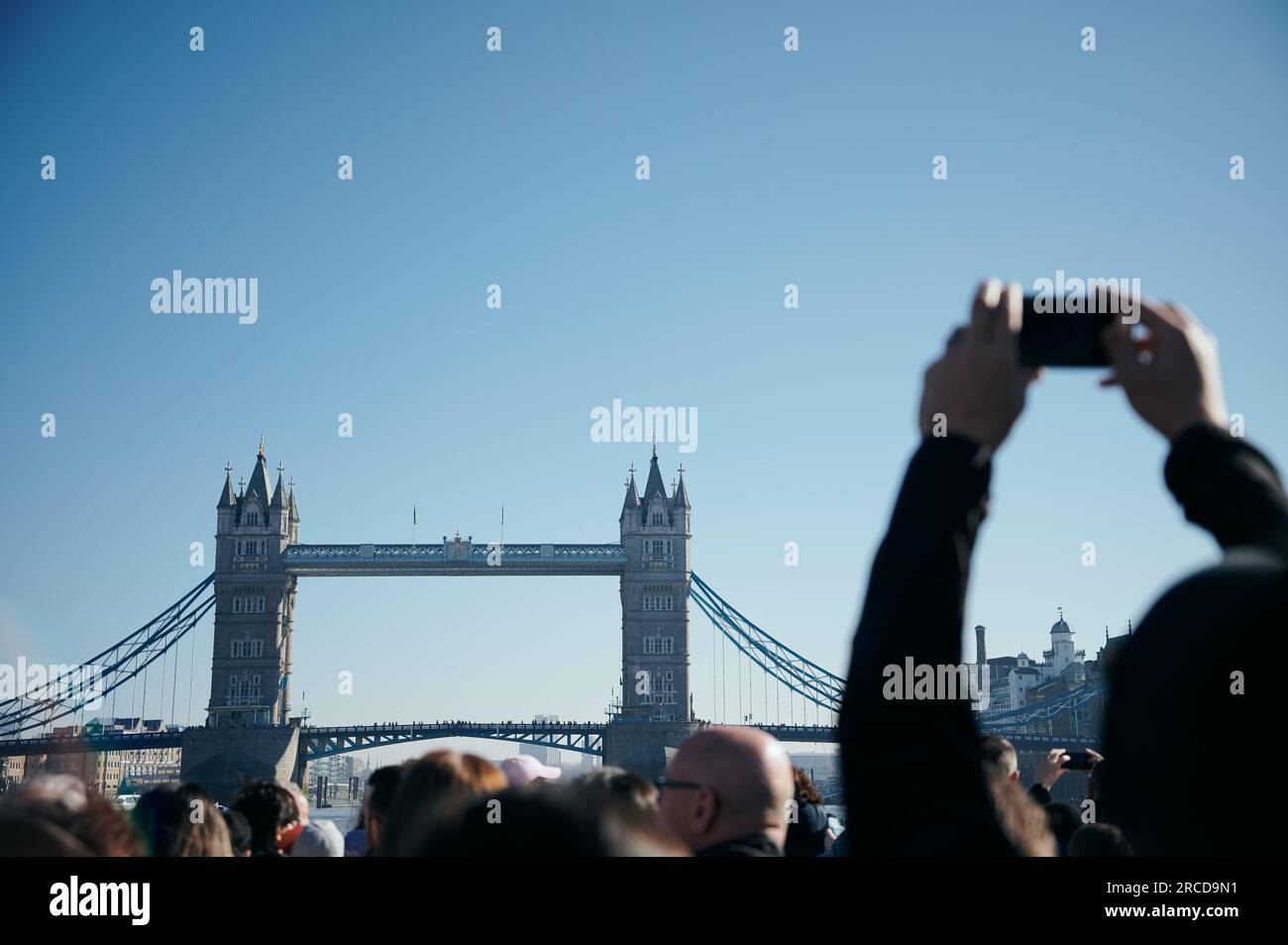 Tourist taking pictures of Tower Bridge Stock Photo