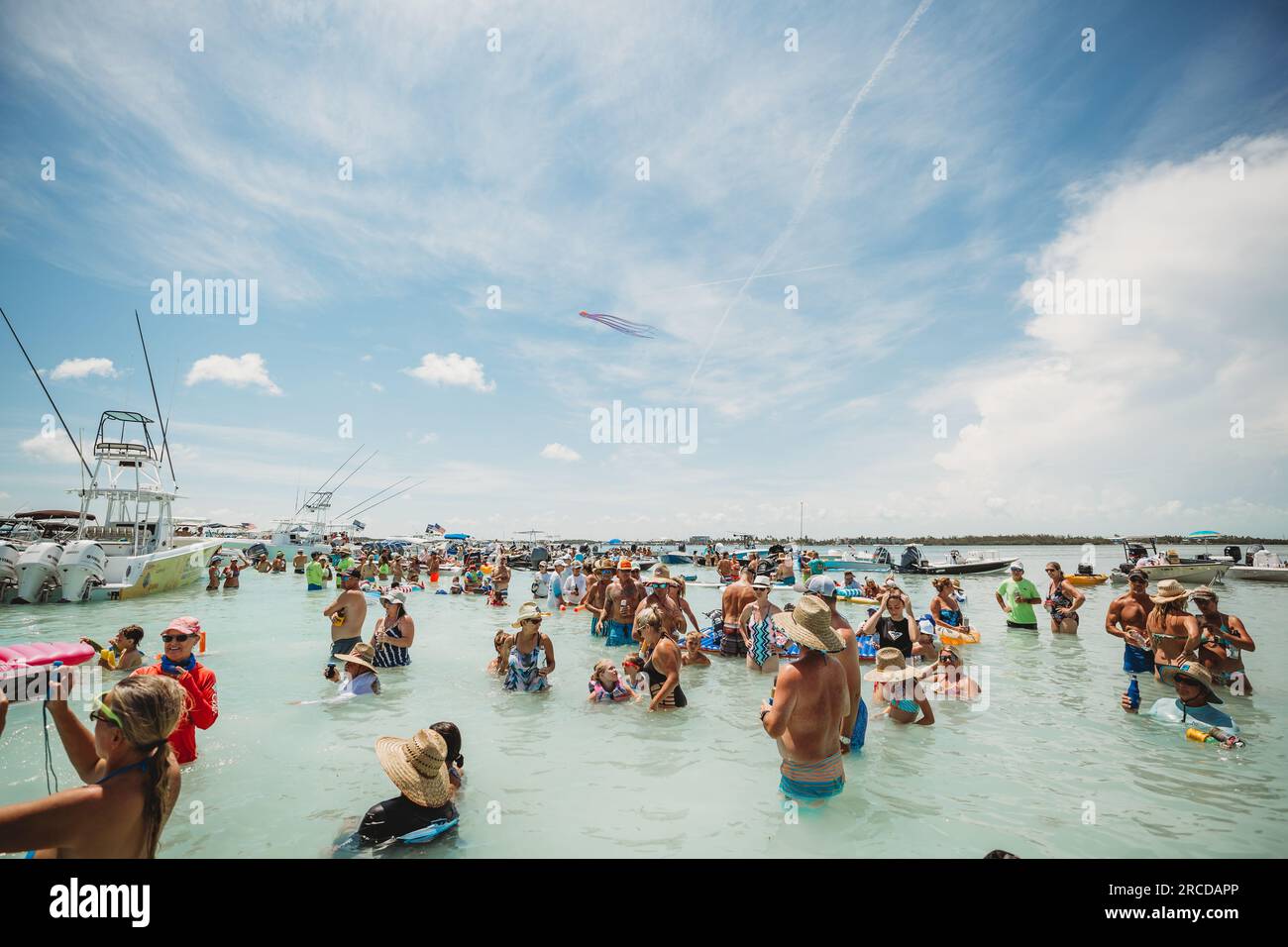 Crowd listens to live band play on the water in the Florida Keys Stock Photo
