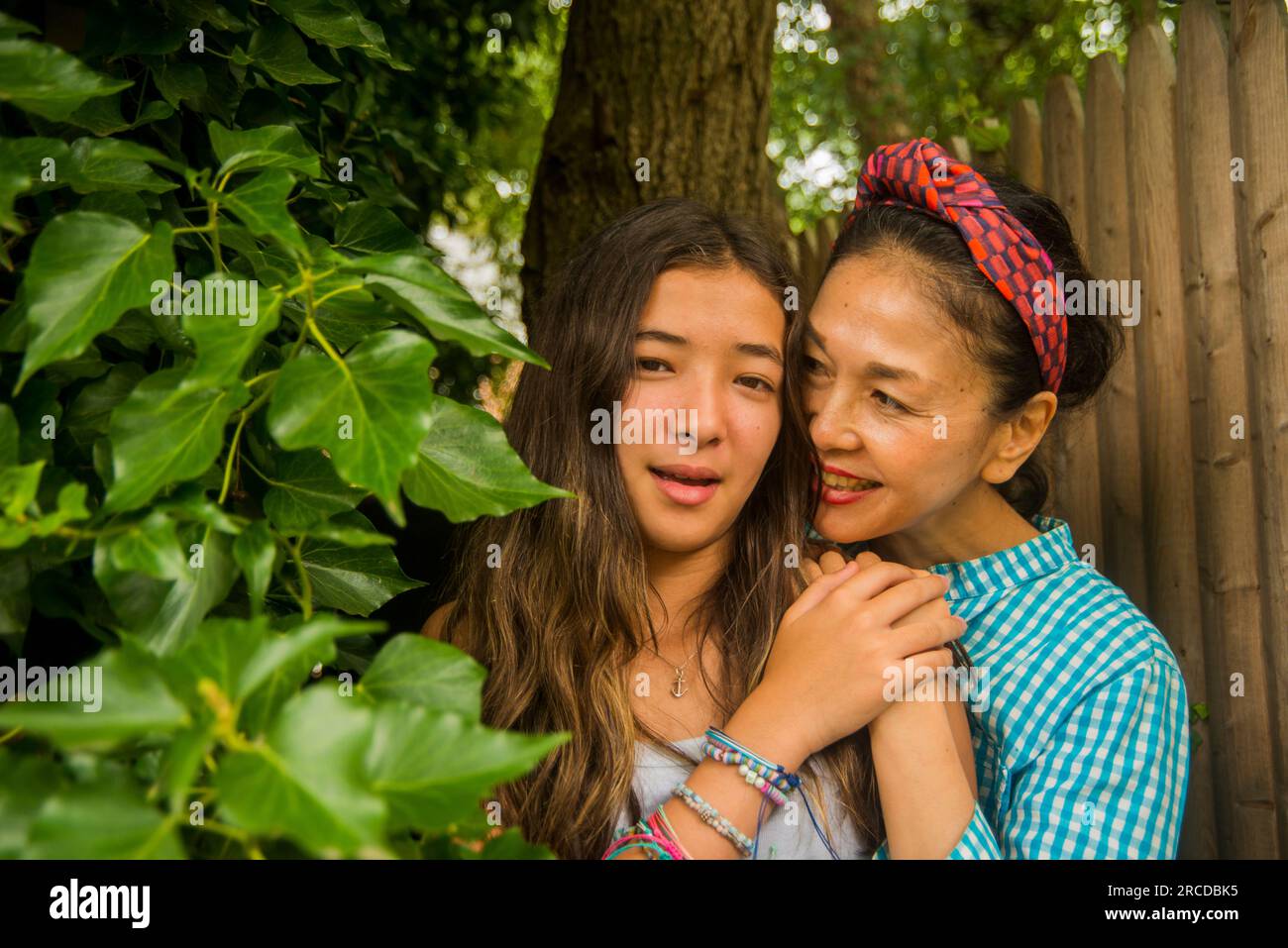 Asian mother and daughter together outside Stock Photo - Alamy