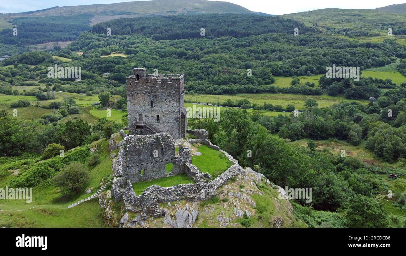 Aerial drone view of the 13th Century hilltop fortification Dolwyddelan Castle, near Blaenau Ffestiniog, Snowdonia, Wales. July 2023 Stock Photo