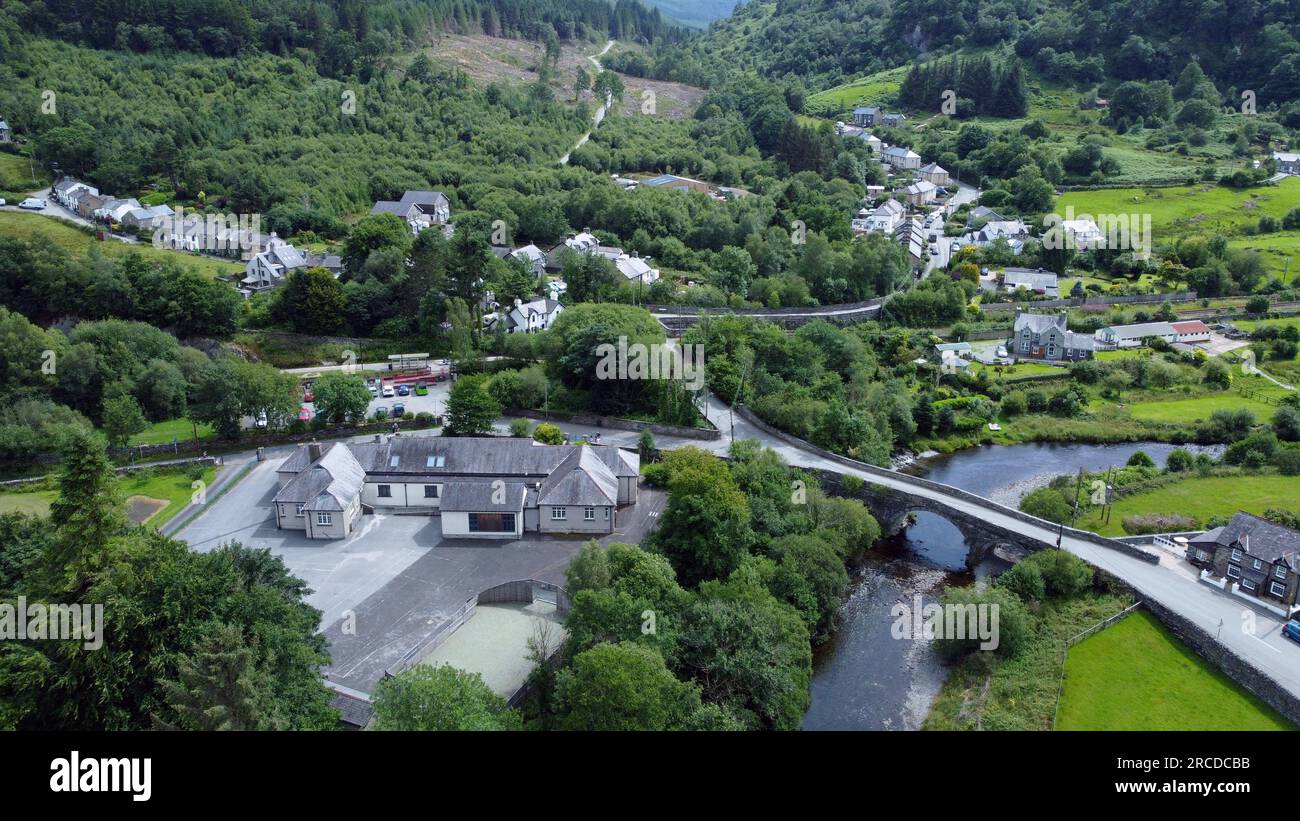 Drone photo of the village of Dolwyddelan, and its bridge over the Afon river Lledr, Snowdonia, Gwynedd, Wales, July 2023 Stock Photo