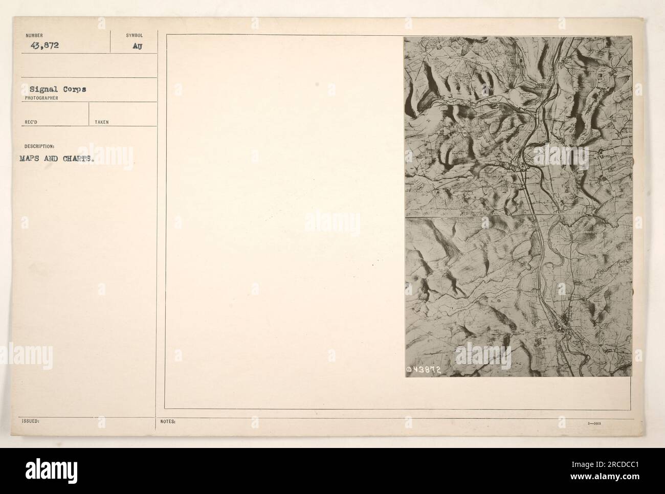 American soldiers examining and studying maps and charts during World ...