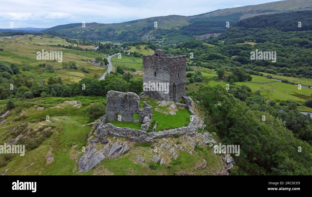 Aerial drone view of the 13th Century hilltop fortification Dolwyddelan Castle, near Blaenau Ffestiniog, Snowdonia, Wales. July 2023 Stock Photo