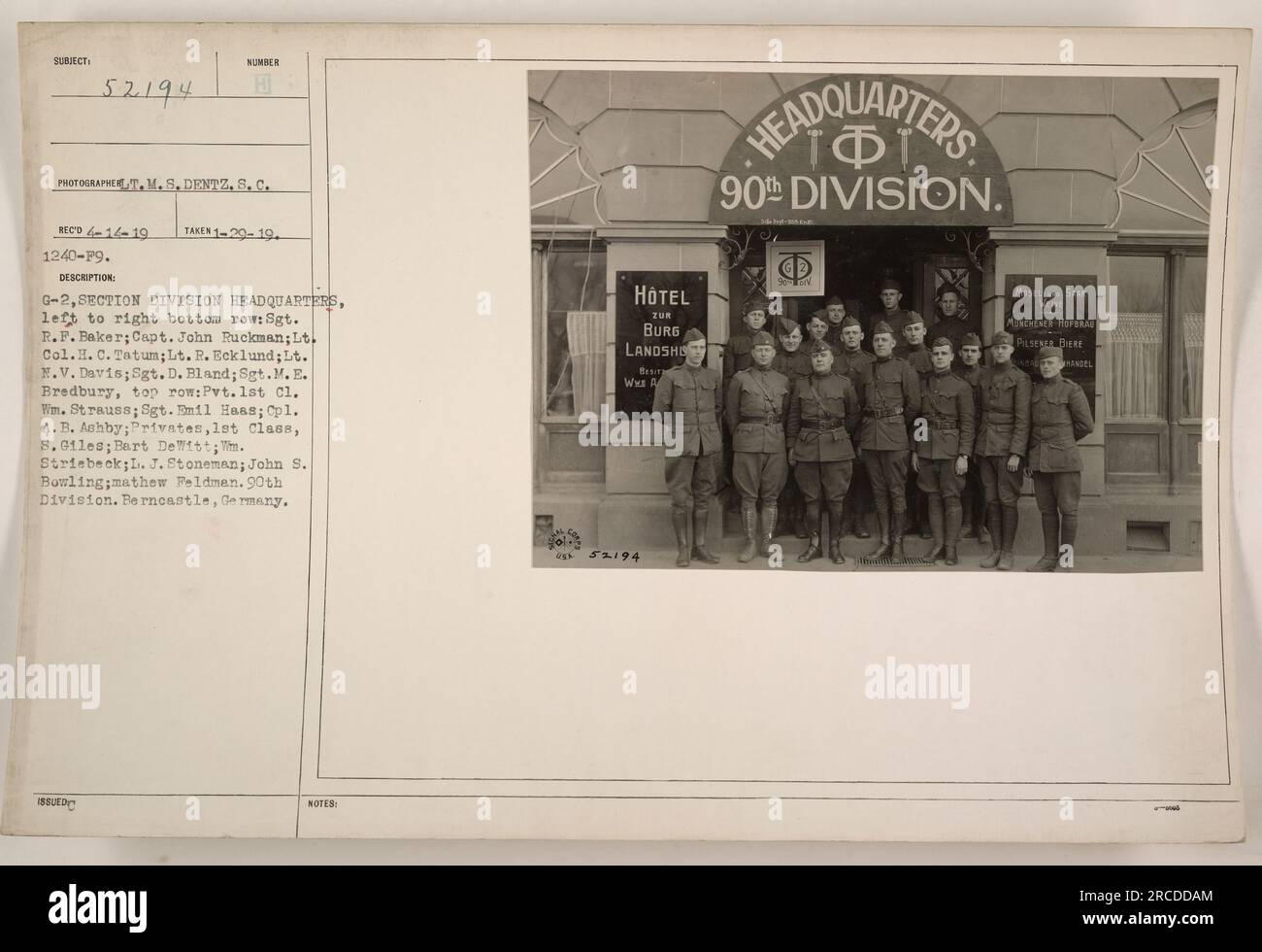 G-2 Section, Division Headquarters of the 90th Division in Berncastle, Germany. The photograph was taken on January 20, 1919, by T.M.S. Dentz. The individuals in the photo are: Sgt. ISSUED R.F. Baker, Capt. John Ruckman, Lt. Col.H. C. Tatum, Lt. R. Ecklund, Lt. M.V. Davis, Sgt. D. Bland, Sgt.M.E. Bredbury, Pvt. 1st Cl. Wm. Strauss, Sgt. Emil Haas, Cpl. A. B. Ashby, Privates 1st Class 8. Giles, Bart DeWitt, M. Striebeck, L. J. Stoneman, John S. Bowling, and Mathew Feldman. The photo was taken at Hotel Zur Burg Landshut. Stock Photo
