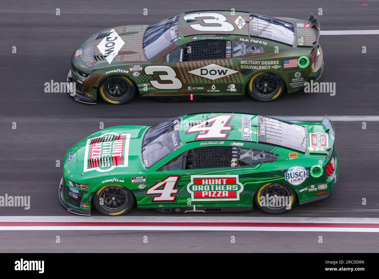 ATLANTA, GA - JULY 09: Kevin Harvick (#4 Stewart Haas Racing Hunt Brothers  Pizza Ford) and Austin Dillon (#3 Richard Childress Racing Dow Salutes  Veterans Chevrolet) race side by side during the