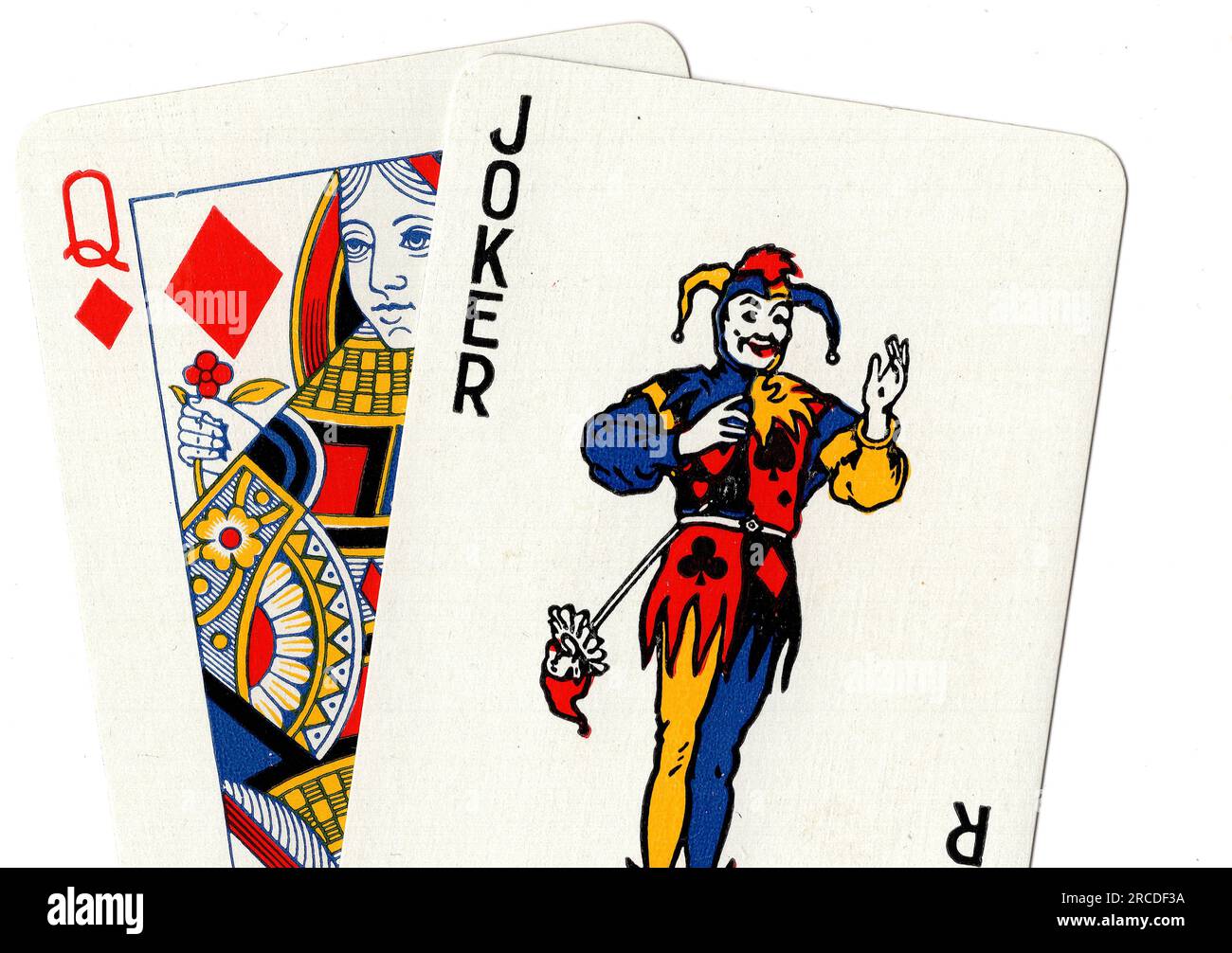 Vintage playing cards showing a joker and a queen of diamonds on a