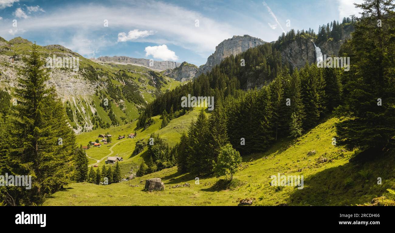 panoramic view of Schächental with Klausenpass and Waterfall Stäuber Stock Photo