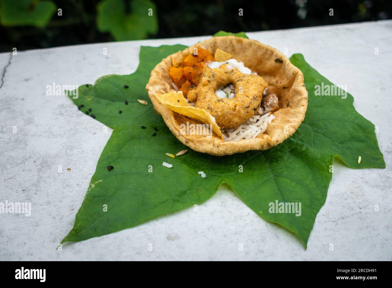 Food placed on a green leaf during a Hindu Ritual in the month of Sharada. Indian Customs and Traditional. Stock Photo