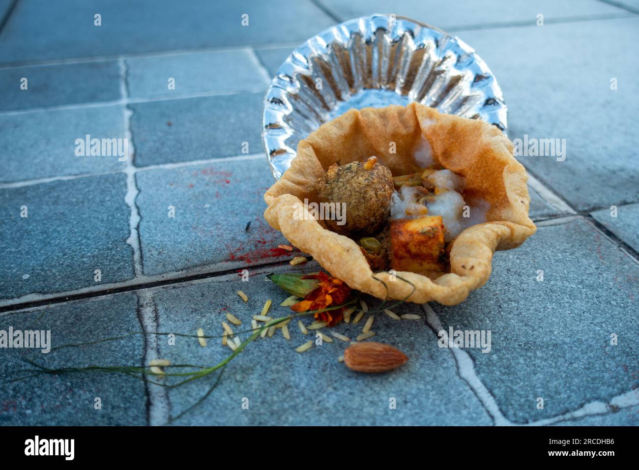 Food placed on a paper plate during a Hindu Ritual in the month of Sharada. Indian Customs and Traditional. Stock Photo