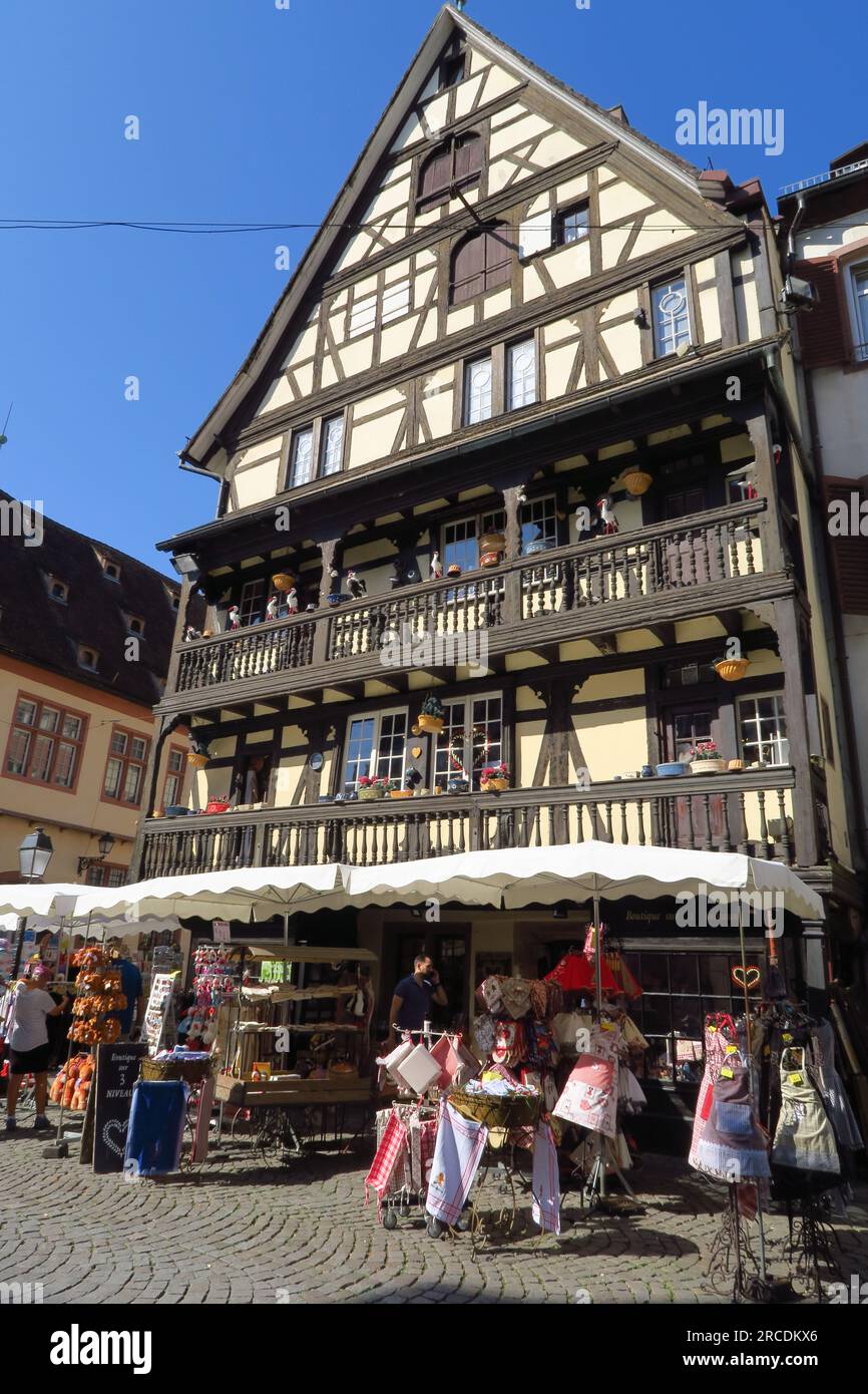 Timer framed building with artificial storks on the balcony in the French town of Strasbourg on the River Rhine Stock Photo