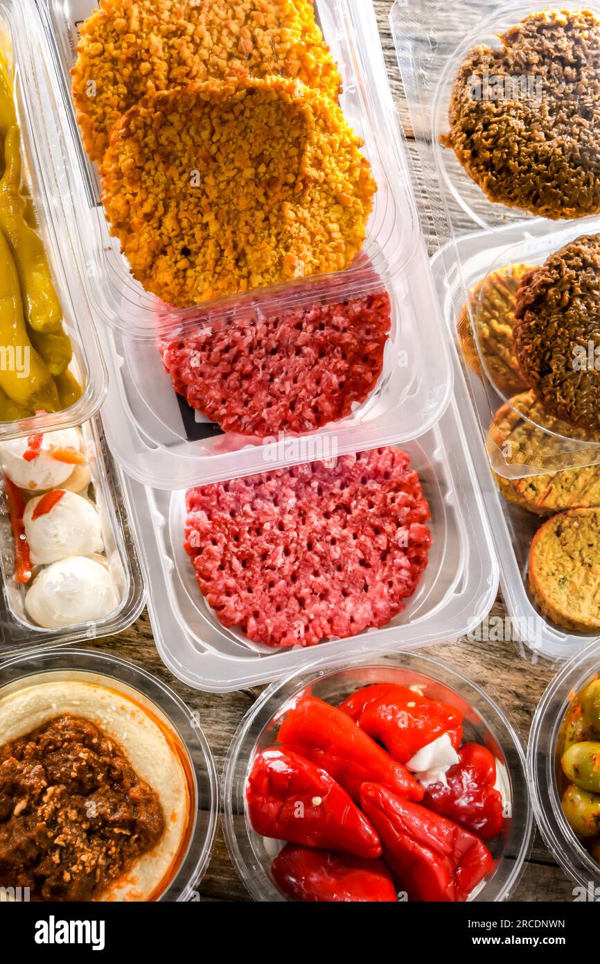 A display of variety of prepackaged food products in plastic boxes ...