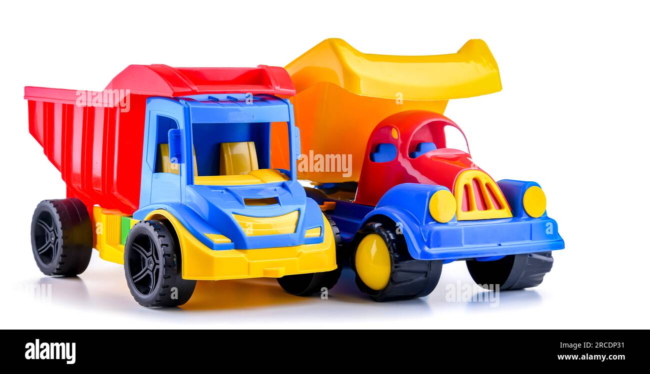 Colorful plastic dump trucks isolated on white background Stock Photo