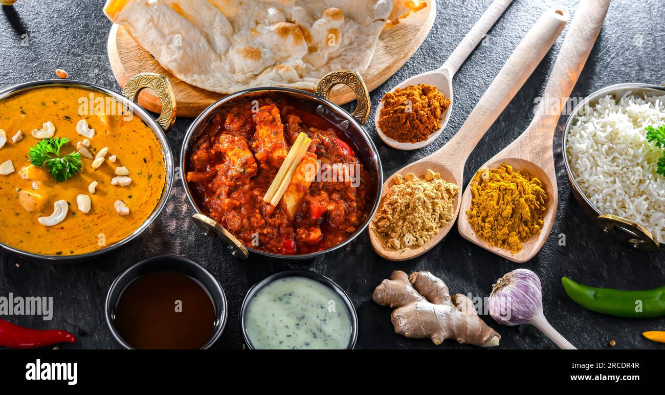 https://c8.alamy.com/comp/2RCDR4R/composition-with-indian-dishes-madras-paneer-palak-paneer-and-shahi-paneer-with-basmati-rice-served-in-original-indian-karahi-pots-2RCDR4R.jpg