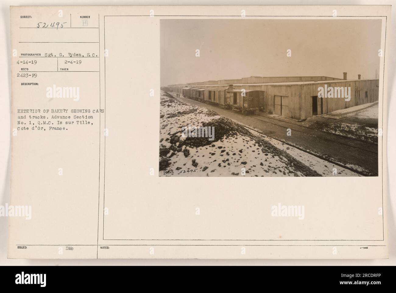 This photograph taken by Sgt. G. Ryden on April 14, 1919, shows the exterior of a bakery in Is sur Tille, Cote d'Or, France. The image features cars and tracks in front of the bakery, belonging to the Advance Section No. 1, Quartermaster Corps (Q.M.C). Stock Photo