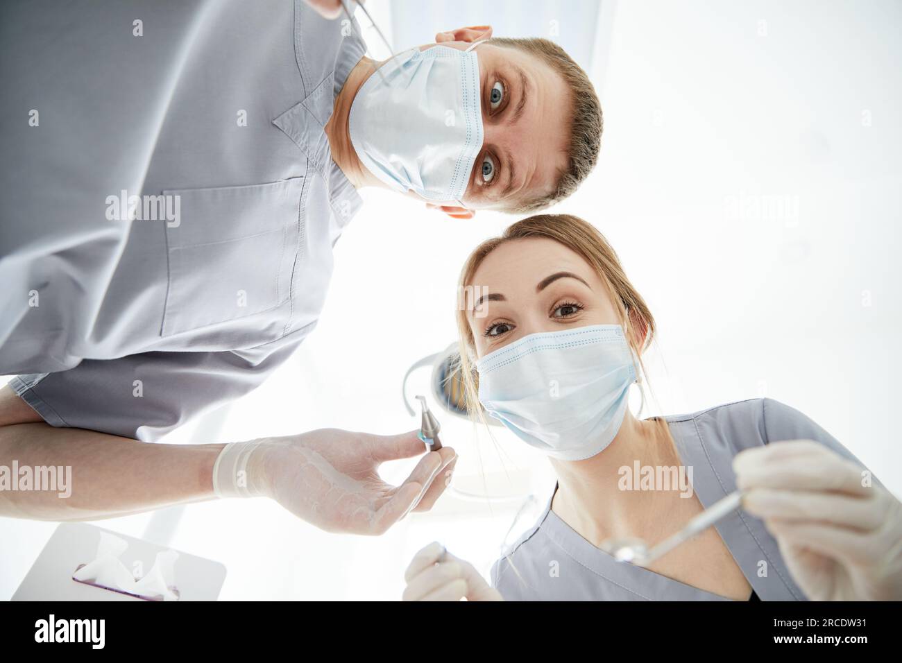 Dentists in masks look hi-res stock photography and images - Alamy