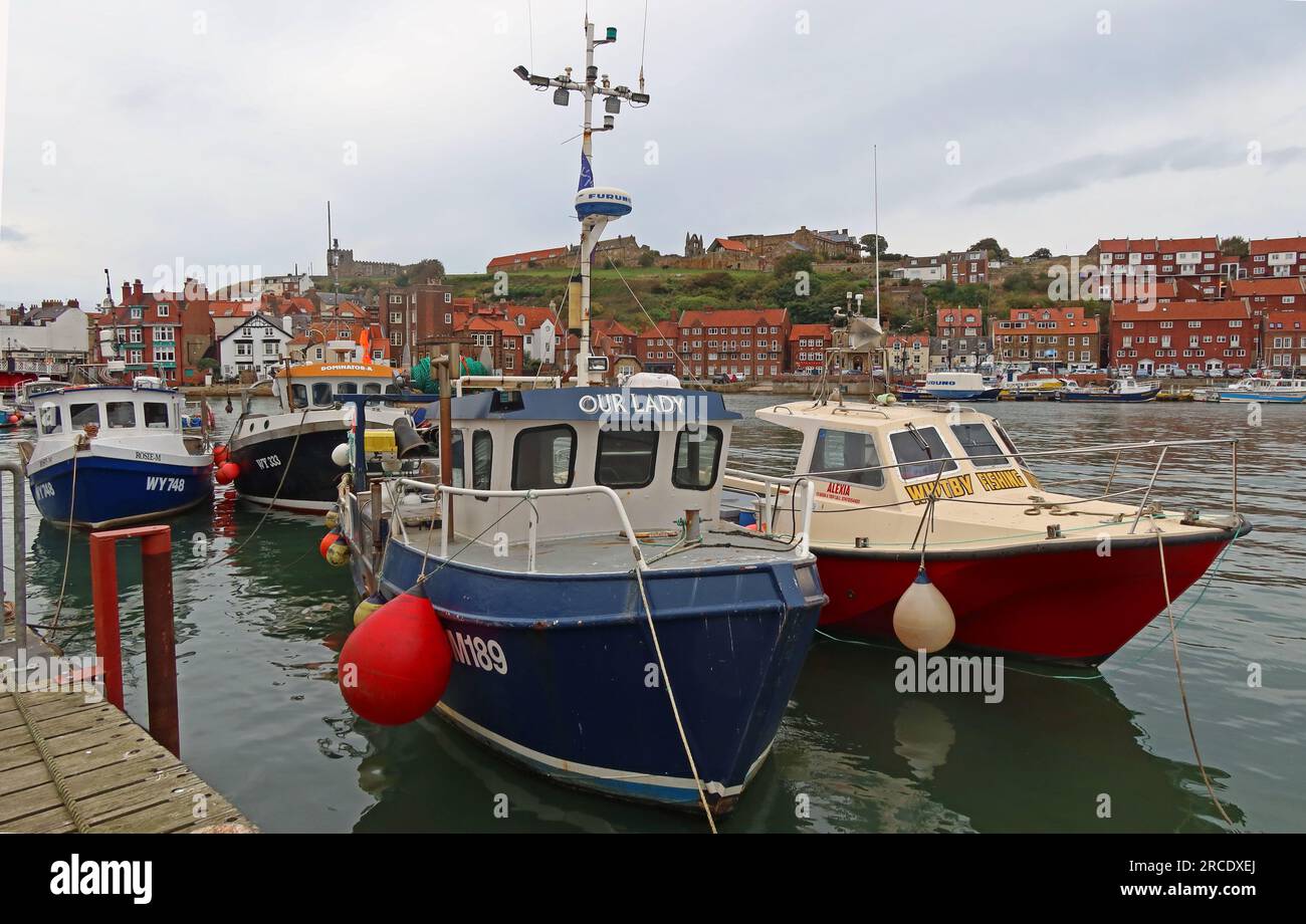 Our Lady Moored boats in Whitby harbour, Whitby, North Yorkshire, England, UK, YO21 1DN Stock Photo