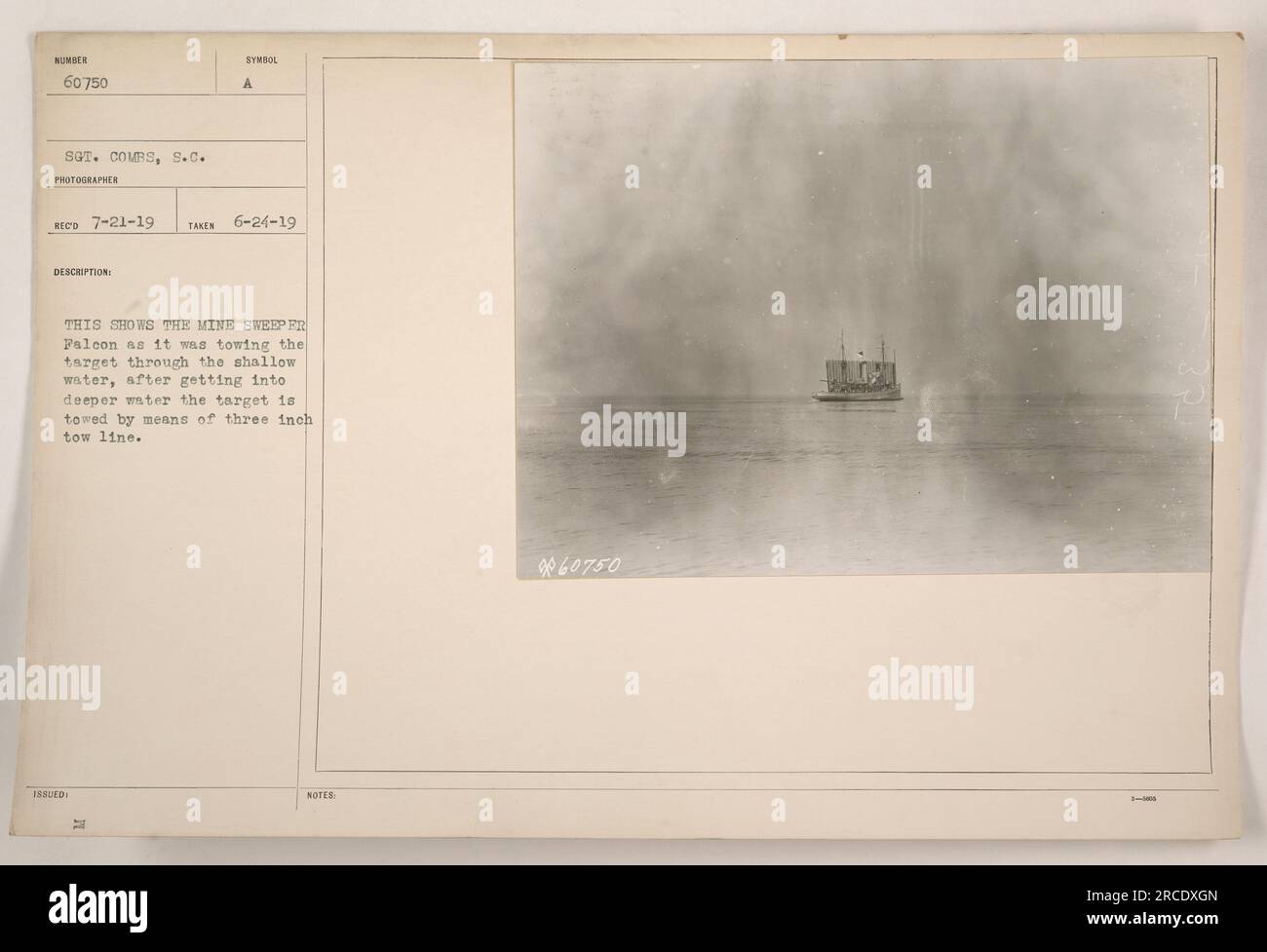 Mine Sweeper Falcon towing a target through shallow water using a three-inch tow line. Shot taken on June 24, 1919, by Sergeant Combs. Symbol issued A. Stock Photo