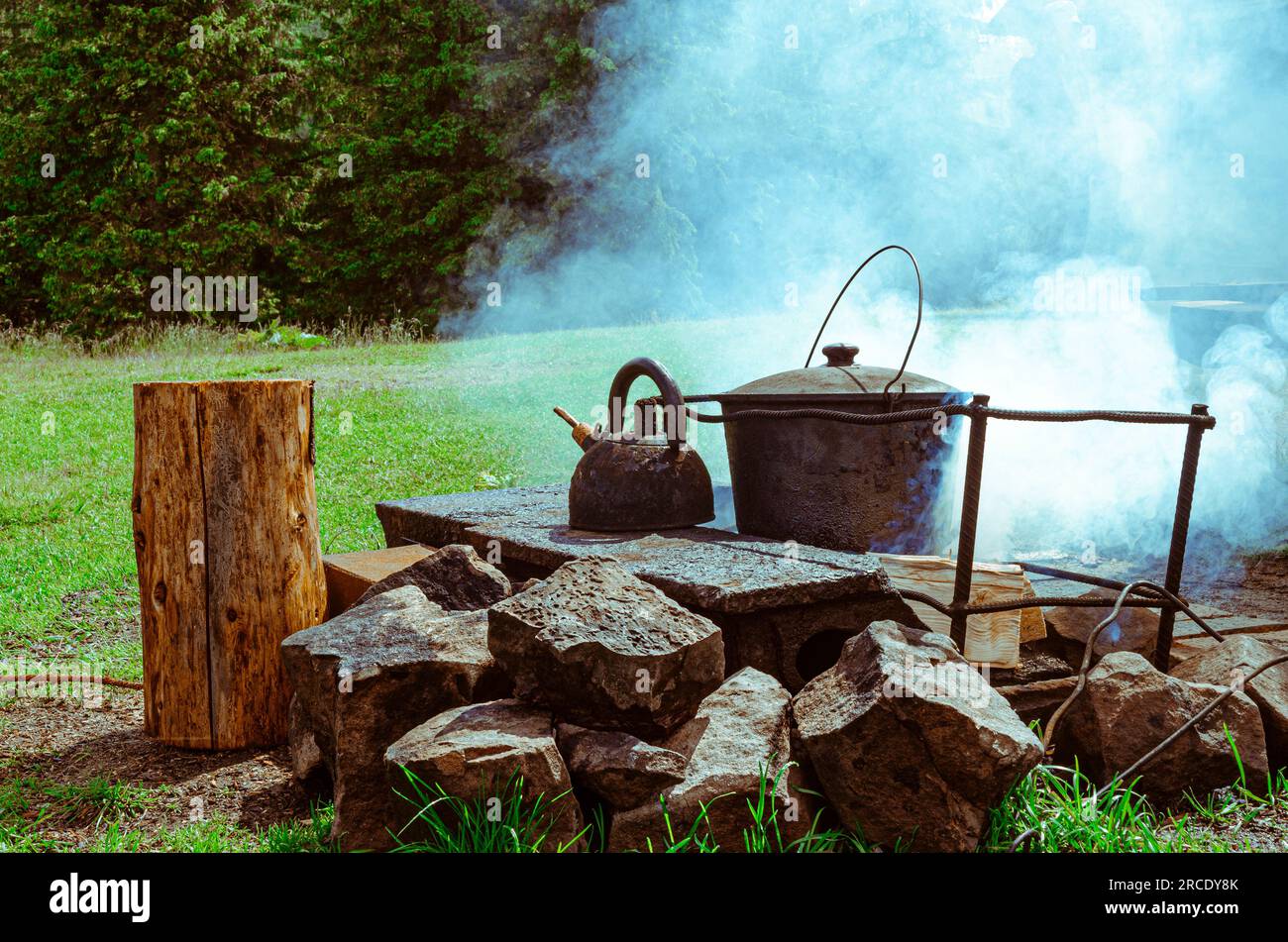 Pot and kettle on the fire. Cooking on a campfire Stock Photo Alamy
