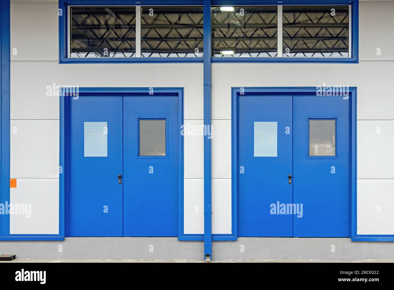 Two Double Doors for People at Distribution Warehouse Stock Photo Alamy