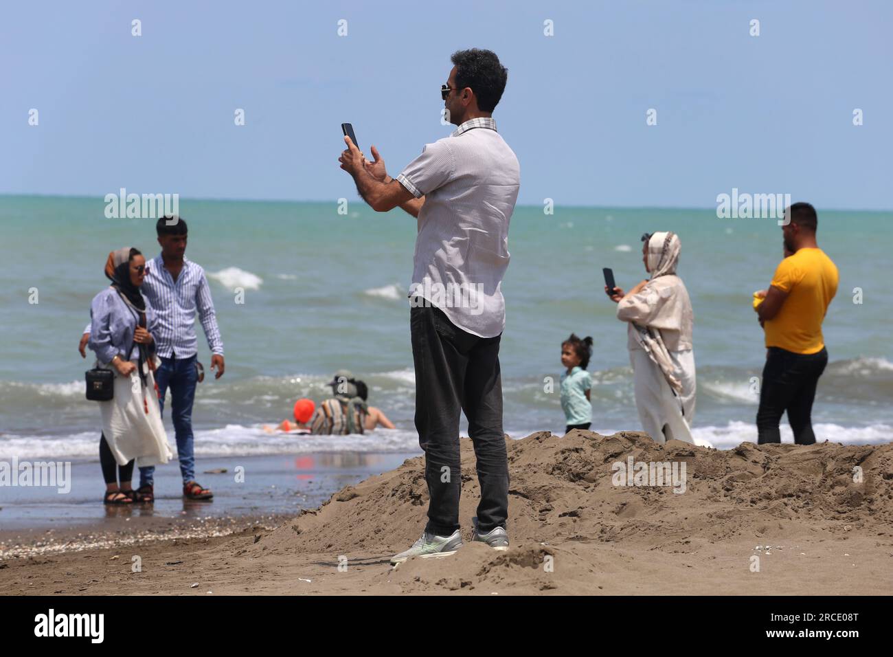 Babolsar, Mazandaran, Iran. 14th July, 2023. An Iranian man takes a
