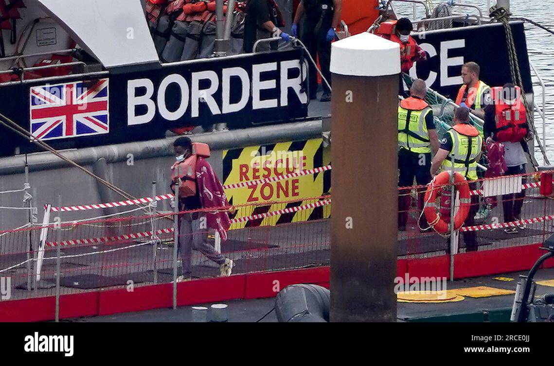 A group of people thought to be migrants are brought in to Dover, Kent ...