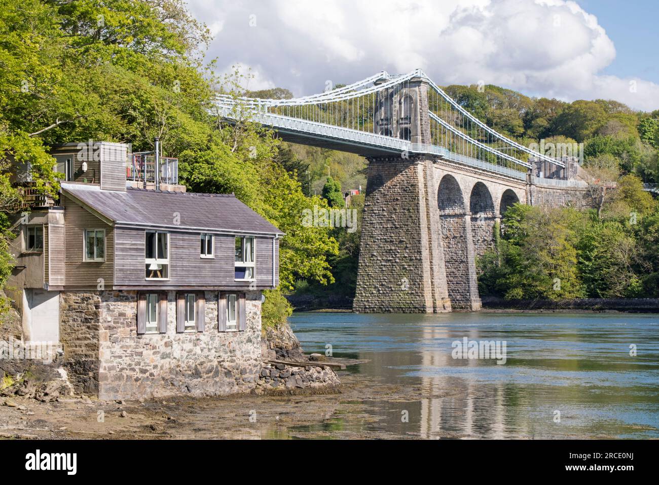 Menai Suspension Bridge crossing the Menai Strait from the Isle of Anglesey and the mainland of Wales. north-west Wales. UK Stock Photo