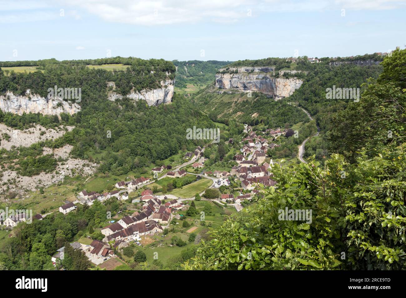 Baume-les-Messieurs and the Limestone Escarpments Surrounding the Village, Viewed from the Cirque de Messiers Trail, Jura, Bourgogne, France Stock Photo
