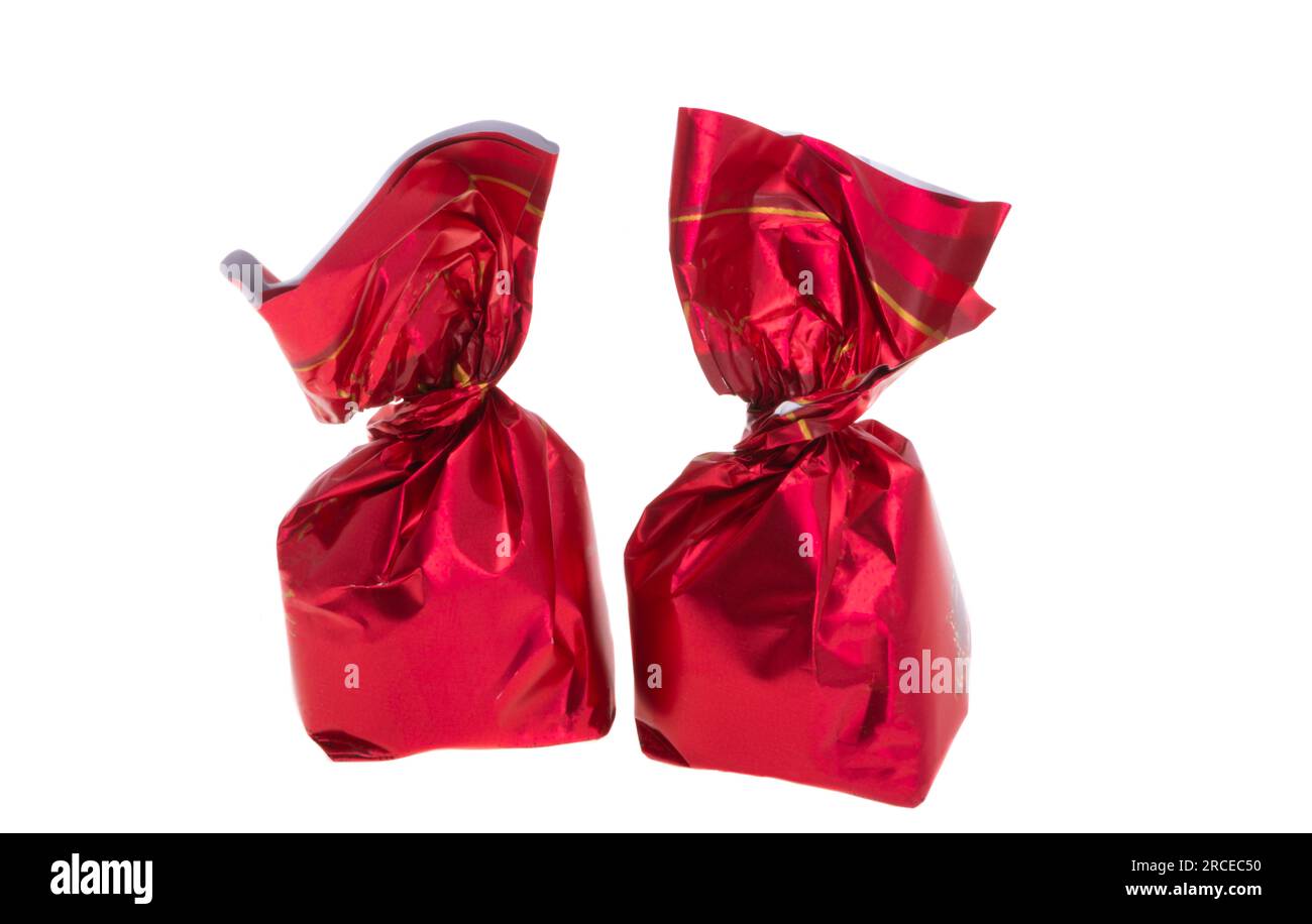 chocolate candies in red wrapper isolated on white background Stock