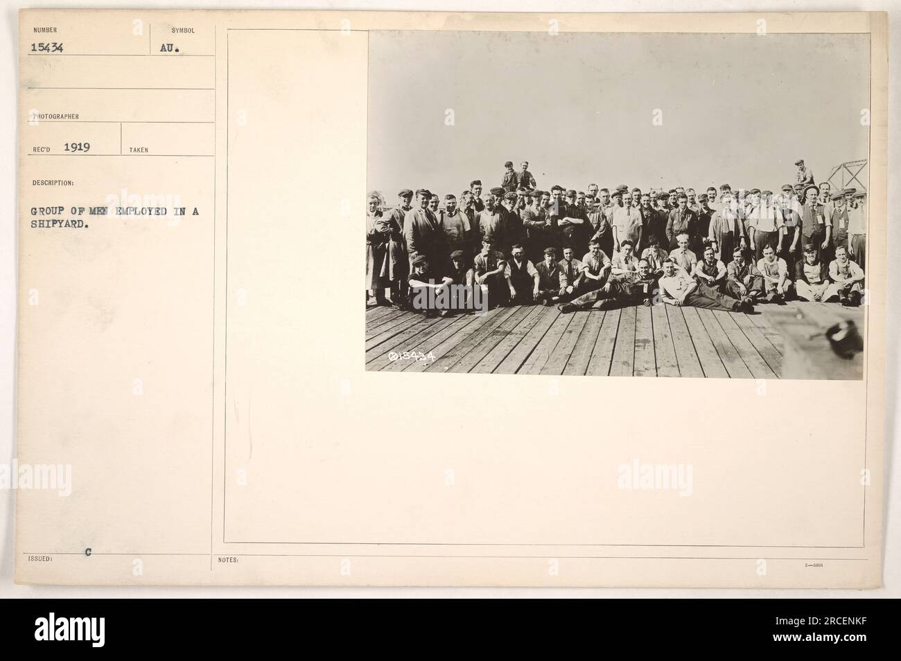 Photo from 1919 showing a group of men working in a shipyard during